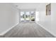 Empty room with carpet and three windows providing natural light at 1404 Meadowind Court Sw, Conyers, GA 30094