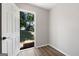 Bright room with wood-look floors leading to a backyard view at 1404 Meadowind Court Sw, Conyers, GA 30094