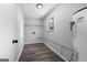 Functional room features a water heater, shelves, and wood-look floors at 1404 Meadowind Court Sw, Conyers, GA 30094