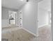 Bright interior view with doorways and light-colored carpet at 1404 Meadowind Court Sw, Conyers, GA 30094