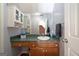 Bathroom boasts a green countertop, wood cabinets, and ample storage at 212 Warrenton Dr, Douglasville, GA 30134