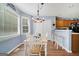 Charming breakfast nook with wood floors, blue walls and lots of natural light at 212 Warrenton Dr, Douglasville, GA 30134