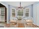Cozy breakfast nook featuring a bay window, wood floors, and a chandelier at 212 Warrenton Dr, Douglasville, GA 30134