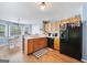 Eat-in kitchen featuring wood cabinets, white countertops and stainless steel appliances at 212 Warrenton Dr, Douglasville, GA 30134
