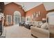 Spacious living room with vaulted ceilings, large windows, and comfortable seating area at 212 Warrenton Dr, Douglasville, GA 30134