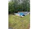 Backyard featuring a sparkling blue in-ground pool with surrounding patio space and lounge chairs at 212 Warrenton Dr, Douglasville, GA 30134