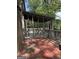 Screened back porch with views of the surrounding foliage offers peaceful outdoor living space at 1055 Worthington Hills Dr, Roswell, GA 30076