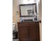 Bathroom vanity with wood cabinets, granite countertop, large mirror and a vessel sink at 1055 Worthington Hills Dr, Roswell, GA 30076