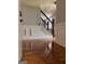 A spacious foyer showcases hardwood floors, detailed trim work, and a staircase with iron railings at 1055 Worthington Hills Dr, Roswell, GA 30076