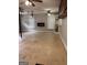 Spacious garage with an electric fireplace, large window, and access to built-in storage shelves at 1055 Worthington Hills Dr, Roswell, GA 30076