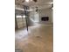 A spacious garage featuring garage door, electric fireplace, and two ceiling fans at 1055 Worthington Hills Dr, Roswell, GA 30076