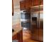 Modern kitchen featuring stainless steel appliances, including a built-in oven and refrigerator at 1055 Worthington Hills Dr, Roswell, GA 30076