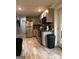 Well-lit kitchen with stainless steel refrigerator and modern grey cabinetry providing ample storage at 1055 Worthington Hills Dr, Roswell, GA 30076