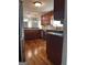 Well-lit kitchen with modern appliances, granite countertops, and hardwood flooring at 1055 Worthington Hills Dr, Roswell, GA 30076