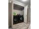 Modern laundry room equipped with side-by-side washer and dryer and organized storage at 1055 Worthington Hills Dr, Roswell, GA 30076