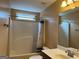 Bathroom with a shower-tub combination with a shower curtain and a window at 1218 Heartwood Ave, Mcdonough, GA 30253