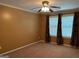 Bedroom with a ceiling fan and three windows at 1218 Heartwood Ave, Mcdonough, GA 30253