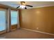 Bedroom with a ceiling fan, large windows and tan carpet at 1218 Heartwood Ave, Mcdonough, GA 30253