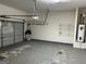 Spacious garage with overhead door and ample storage space at 1218 Heartwood Ave, Mcdonough, GA 30253