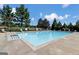 Large community pool with mature trees and landscaping at 1218 Heartwood Ave, Mcdonough, GA 30253