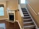 Carpeted staircase with a fireplace at 1218 Heartwood Ave, Mcdonough, GA 30253