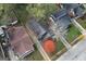 Aerial view of a property showcasing the home, landscaped yard, and surrounding neighborhood at 1660 Rogers Sw Ave, Atlanta, GA 30310