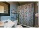 Bathroom featuring a vanity, toilet, and shower with a butterfly-themed curtain at 1660 Rogers Sw Ave, Atlanta, GA 30310