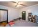 Cozy bedroom featuring a ceiling fan, a large bed, and ample natural light at 1660 Rogers Sw Ave, Atlanta, GA 30310