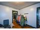 Bedroom featuring hardwood floors, light walls, black trim, and doorways to additional rooms at 1660 Rogers Sw Ave, Atlanta, GA 30310
