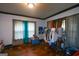 Bedroom with hardwood floors and curtains covering the windows for privacy at 1660 Rogers Sw Ave, Atlanta, GA 30310