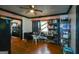 Dining area featuring hardwood floors, a glass table, and convenient access to the kitchen and living spaces at 1660 Rogers Sw Ave, Atlanta, GA 30310
