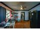 Dining area with hardwood floors, a glass table with chairs, and convenient access to the kitchen at 1660 Rogers Sw Ave, Atlanta, GA 30310