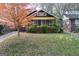 Well-maintained home with a vibrant orange tree and a cozy, enclosed porch at 1660 Rogers Sw Ave, Atlanta, GA 30310