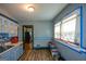 Bright kitchen with blue cabinets, a double basin sink, tile backsplash, and window at 1660 Rogers Sw Ave, Atlanta, GA 30310