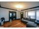 Inviting living room features hardwood floors, a comfortable sectional sofa, and natural light from bright windows at 1660 Rogers Sw Ave, Atlanta, GA 30310