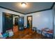 Living room with dark trim, wood floors, and doorways leading to additional rooms at 1660 Rogers Sw Ave, Atlanta, GA 30310