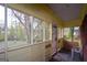 Enclosed porch with screens, offering a view of the backyard, and an outside entrance at 1660 Rogers Sw Ave, Atlanta, GA 30310