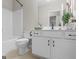 Well lit bathroom features a shower and tub, along with stylish vanity and decor at 175 N Unity Grove Rd, Locust Grove, GA 30248
