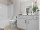 Clean bathroom features white vanity, toilet, and combined shower and bathtub at 175 N Unity Grove Rd, Locust Grove, GA 30248