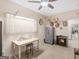 Bedroom with a ceiling fan, a window, a gun safe, a table and chair, and a bookshelf at 175 N Unity Grove Rd, Locust Grove, GA 30248