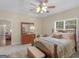 Spacious bedroom with a wood-framed bed, a chest at the foot, and natural light from the window at 175 N Unity Grove Rd, Locust Grove, GA 30248