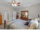 Relaxing bedroom features natural light and decor with wooden furniture at 175 N Unity Grove Rd, Locust Grove, GA 30248