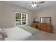 Bedroom with neutral walls, a ceiling fan, a bed with a light blue cover, and a window at 175 N Unity Grove Rd, Locust Grove, GA 30248