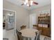 Cozy dining area featuring a round table, wooden chairs, and built-in hutch at 175 N Unity Grove Rd, Locust Grove, GA 30248