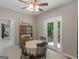 Bright dining area with a round table and hutch, bathed in light from the nearby glass patio doors and deck at 175 N Unity Grove Rd, Locust Grove, GA 30248