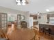 Inviting dining area featuring hardwood floors and an open layout to the kitchen and living room, perfect for entertaining at 175 N Unity Grove Rd, Locust Grove, GA 30248