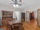 Traditional dining room featuring hardwood floors, a ceiling fan, and wooden furniture at 175 N Unity Grove Rd, Locust Grove, GA 30248