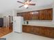 Spacious kitchen with ample wooden cabinetry, white refrigerator, offering plenty of storage and food preservation space at 175 N Unity Grove Rd, Locust Grove, GA 30248