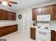 Traditional kitchen featuring ample wood cabinetry and white appliances at 175 N Unity Grove Rd, Locust Grove, GA 30248