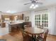 Kitchen and dining area with wooden table, chairs, cabinets, and large window at 175 N Unity Grove Rd, Locust Grove, GA 30248